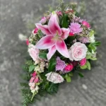 Tear drop coffin spray flowers in pinks